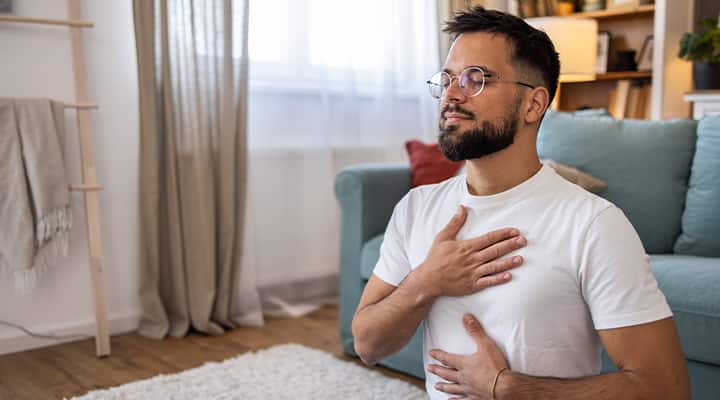 Man meditating  affirmations in the morning.
