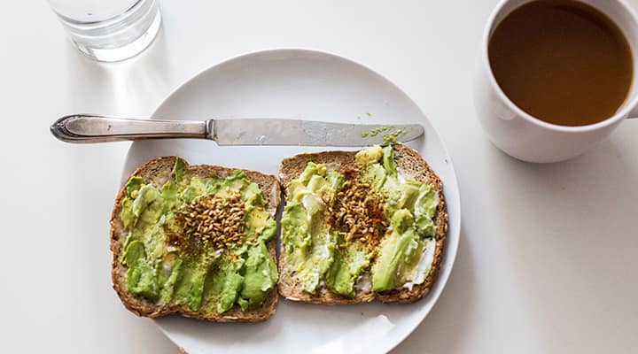 Avocado toast with coffee for breakfast as an easy way to add avocado to a diet
