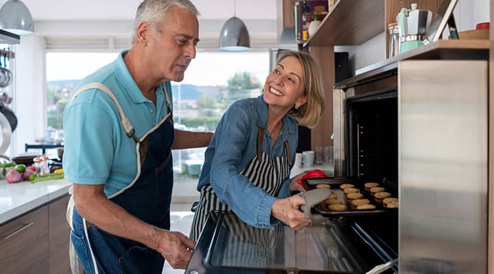Whey protein cookies being pulled out of oven after baking