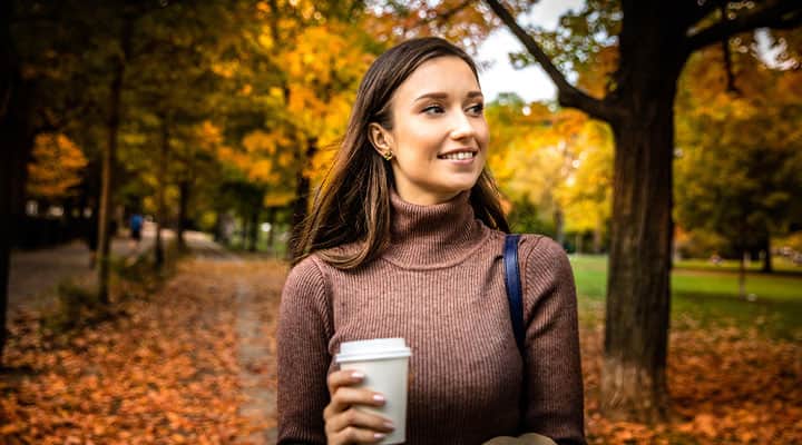 Woman walking outside in the fall