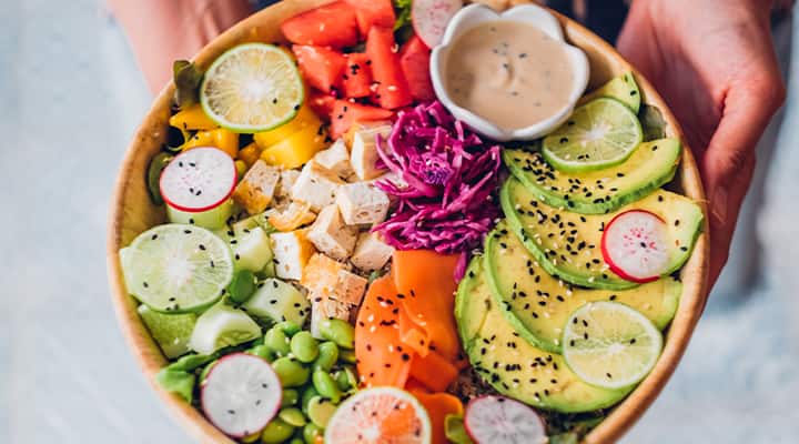 Fill your salad with edamame and salmon for protein and fiber in one tasty dish!