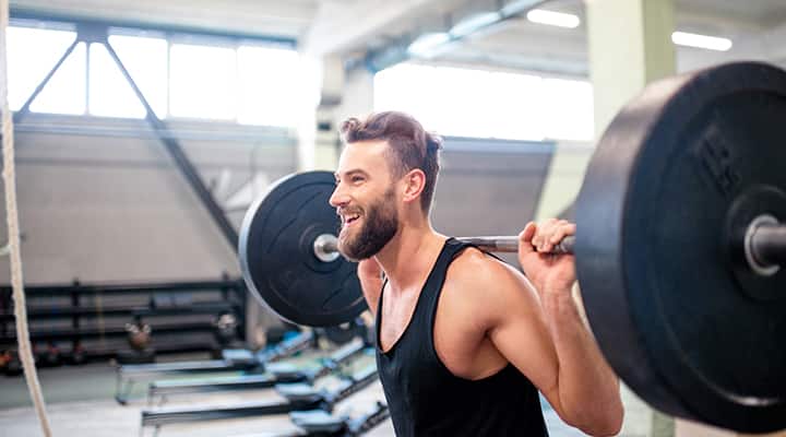 Caption: A calorie surplus plus strength training helps build muscle.