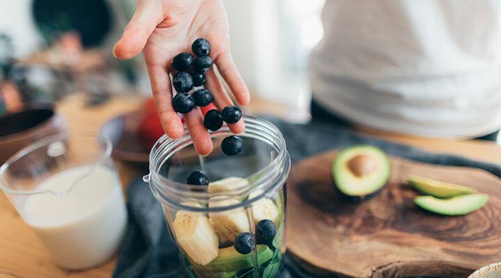 Man making healthy smoothie from the Mediterranean diet