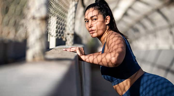 Woman taking a rest in between running for exercise