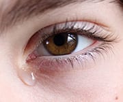 Woman with eye discomfort