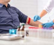 Man having blood taken to take liposomal hydrogel vitamin c marker